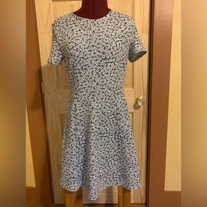Short sleeve swing dress with blue flowers.